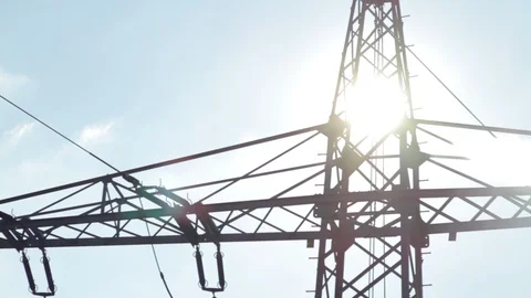 High voltage power pylons close up on against the sun. Silhouette Stock Footage 86219334