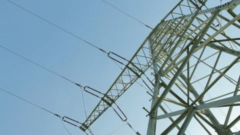 High voltage power pylons low angle on against blue sky. Stock Footage 86219426
