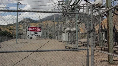High voltage power station tripod pan Stock Footage