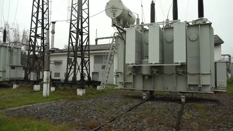 High voltage power station. Wide angle, high voltage substation with tall pylons Stock Footage 165243738