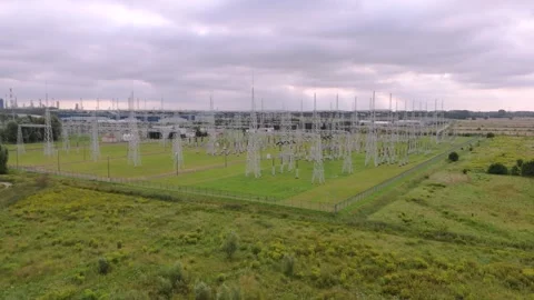 High voltage power substation with transmission towers and electrical grid Stock Footage 315515320