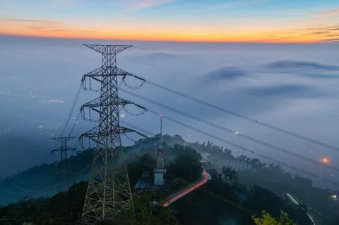 High voltage power tower and mountain road in Meishan, Taiwan Stock-Fotos