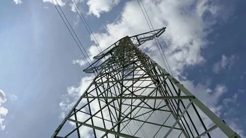 High Voltage Power Tower with Blue Sky and Clouds on Background Stock Footage 141383571