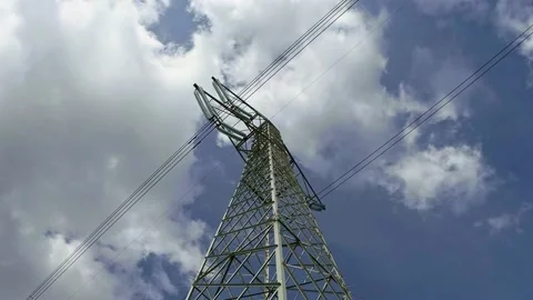High Voltage Power Tower Lines with Blue Sky and Clouds on Background Stock Footage 141383763