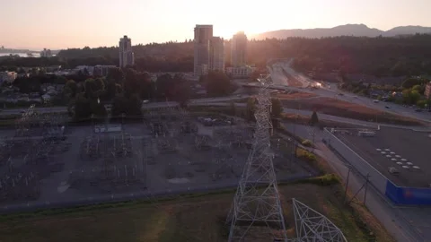 High voltage power transmission tower and lines near a transformer station Stock Footage 249726730
