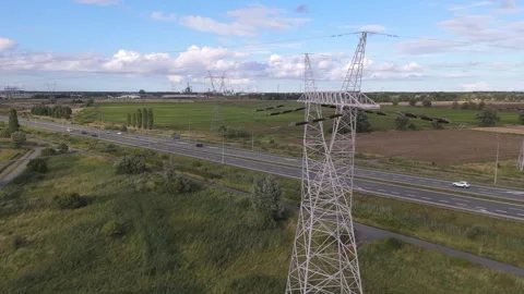 High-Voltage Power Transmission Tower and Electrical Grid Infrastructure Near Stock Footage 344231899