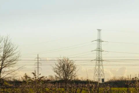High voltage pylon with cables and landscape Stock Photos