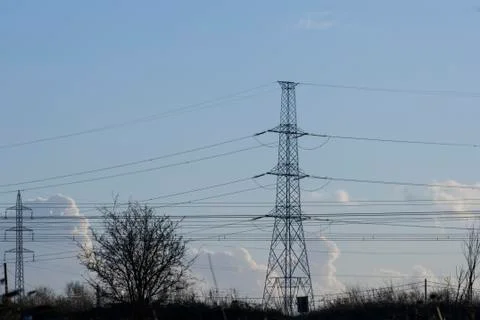 High voltage pylon with cables and landscape Stock Photos