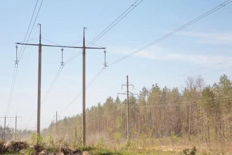 High voltage pylon close to motorway Stock Photos