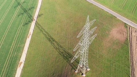 A high voltage pylon in the evening from above Stock Footage 151630690