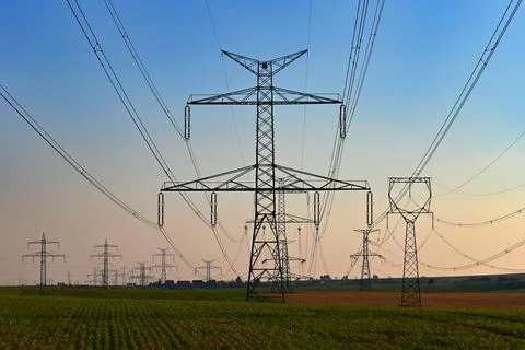 High voltage pylons. Concept for technology and industry. Rising energy price Stock Photos