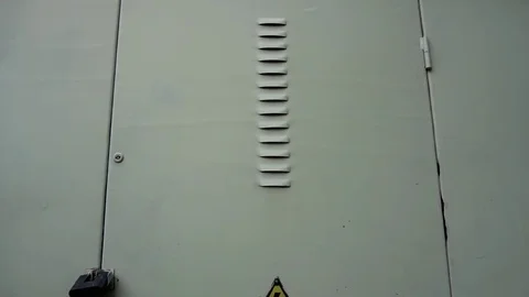 High voltage sign on the door that indicates that beyond that door you can find Stock Footage 75915020