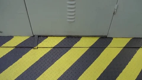 High voltage sign on the door that indicates that beyond that door you can find Stock-Footage 75915332