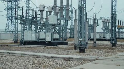 High voltage substation 110 kV tall pylons and hog voltage distribution cables Stock Footage 130776085