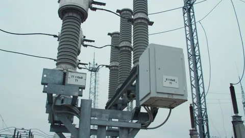 High voltage substation 110 kV tall pylons and hog voltage distribution cables Stock Footage 130776209
