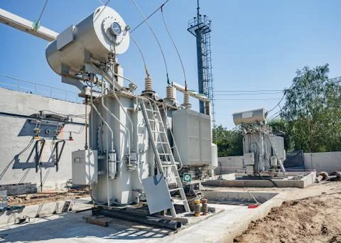 High-voltage substation on blue sky background Stock Photos