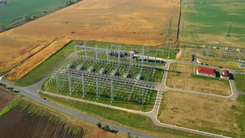 High voltage substation in green fields. Stock Footage 164873584