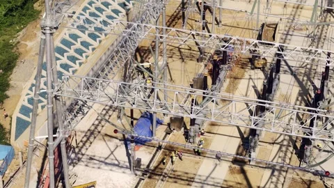 High Voltage Substation Under Construction with Solar Panels on Hillside 스톡 동영상 344440305