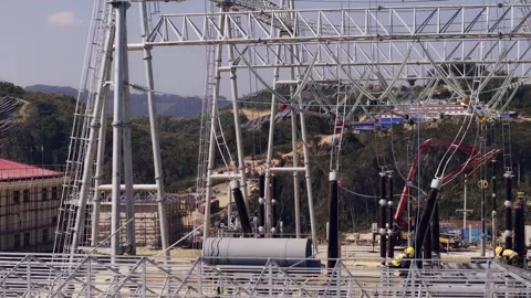 High Voltage Substation Under Construction with Solar Panels on Hillside Video stock 344440472