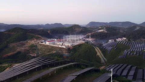 High Voltage Substation Under Construction with Solar Panels on Hillside Video stock 344441711