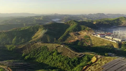 High Voltage Substation Under Construction with Solar Panels on Hillside 스톡 동영상 344446074