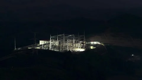 High Voltage Substation Under Construction with Solar Panels on Hillside 스톡 동영상 344446309