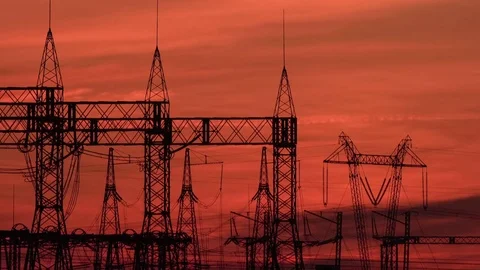 A high voltage substations, in the sunset. Transmission power lines. Timelapse Stock Footage 74334776