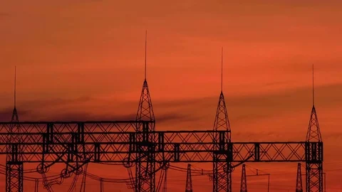 A high voltage substations, in the sunset. Transmission power lines. Timelapse Stock Footage 74335407