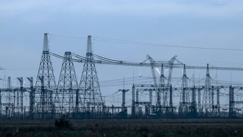 A high voltage substations, in the sunset. Transmission power lines. Heat haze Stock Footage 75629057