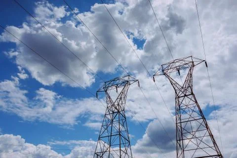High-voltage support. clouds in the sky - scale power plant danger. power pla Stock Photos