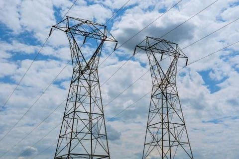 High-voltage support. clouds in the sky - scale power plant danger. power pla Stock Photos