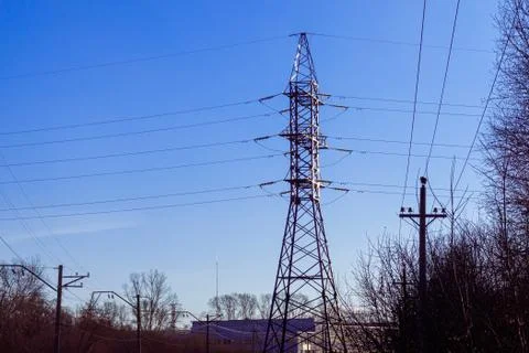 High voltage supports of two intersecting power lines of different voltage ag Stock Photos