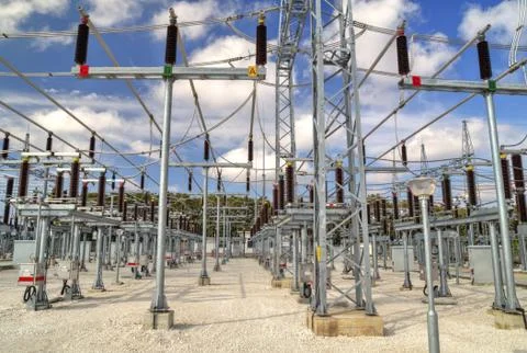 High voltage switchyard in electrical substation Stock Photos
