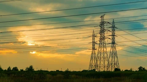 High Voltage Time laps Poles Evening sunset.Black silhouette Stock Footage 104613695
