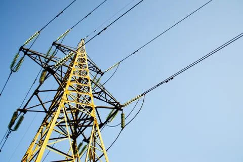 High-voltage tower against the blue sky Stock Photos