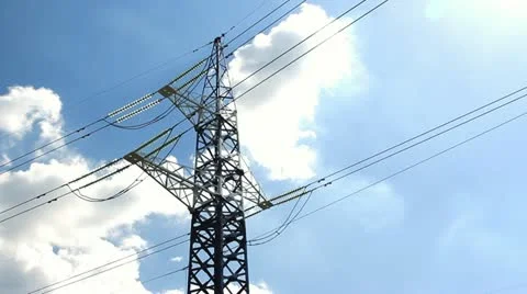 High voltage tower and cables against blue sky Stock Footage 11357906