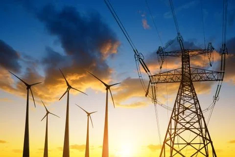 High voltage tower and wind turbines Stock Photos