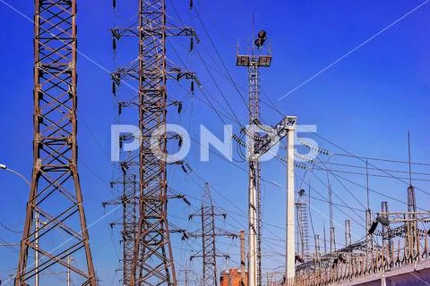 High voltage tower. Electric pole on blue sky background. The problem of ecol Stock Photos