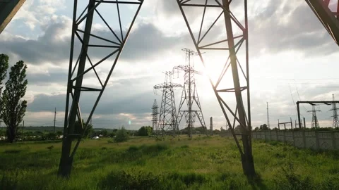 High voltage tower with electric power lines at Stock Footage 249699990