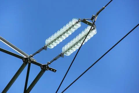 High voltage tower with electrical voltage wires isolates close-up against .. Stock Photos
