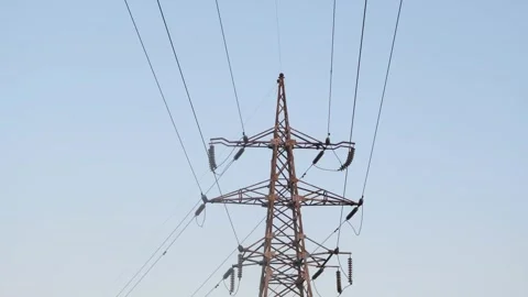 High-voltage tower in a field against the blue sky. High voltage tower. Static Stock-Footage 262534748