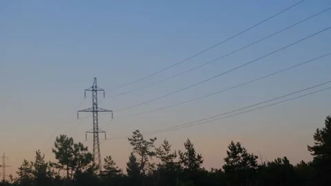 High-voltage tower in a field against the blue sky. High voltage tower. Static Stock Footage 263149625