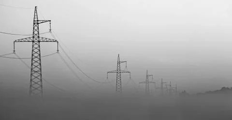 High-voltage tower in the fog Stock Photos