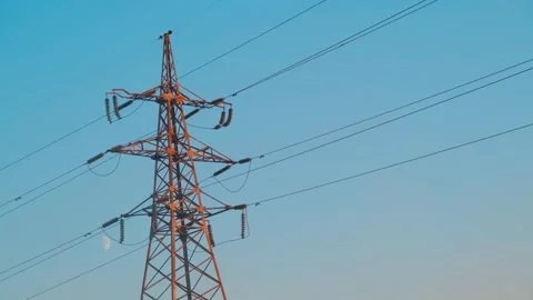 High voltage tower. High-voltage tower in a field against the blue sky. Static Video stock 261221483