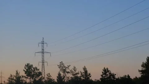High voltage tower. High-voltage tower in a field against the blue sky. Static Video stock 261221578