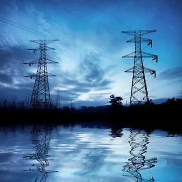 The high-voltage tower at night Stock Photos