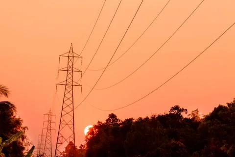 High voltage tower at sunset Stock Photos