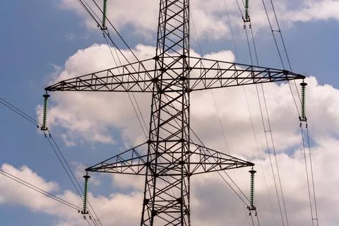High voltage towers with sky background. Power line support with wires for Stock Photos