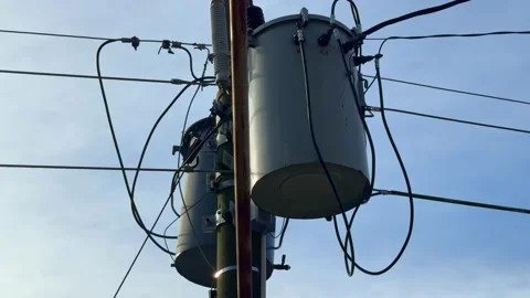 High-voltage transformers and electric cables on a power pole, Stock Footage 314037741