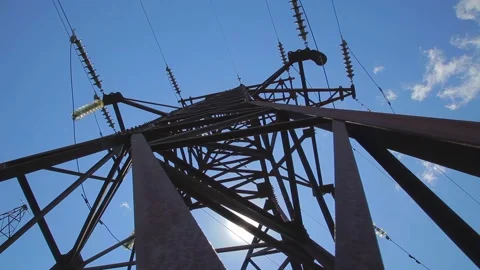 High-voltage transmission line. High voltage power pylons against blue sky. Stock Footage 258067504